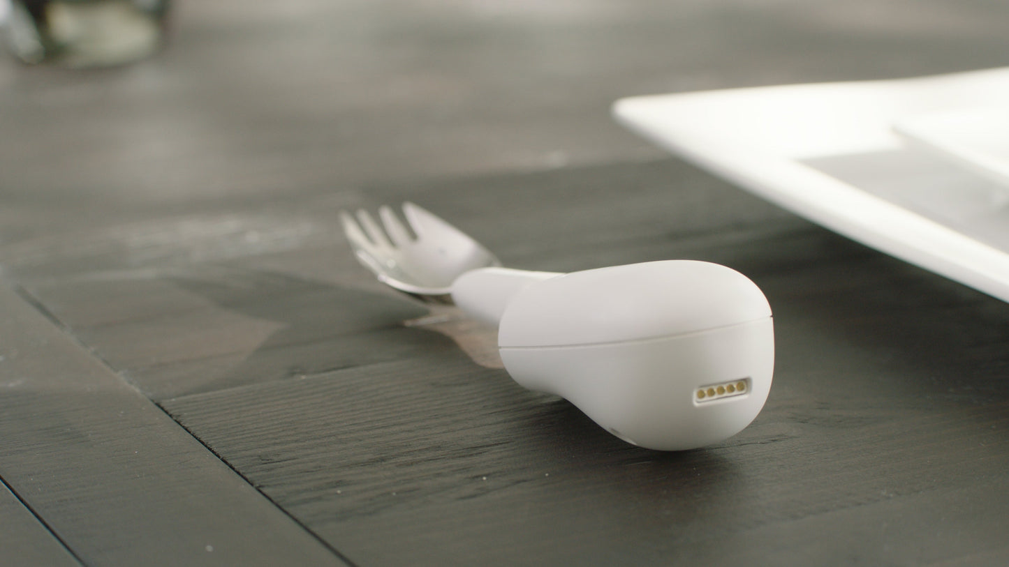 image of the liftware steady on a table with the Spork attachment