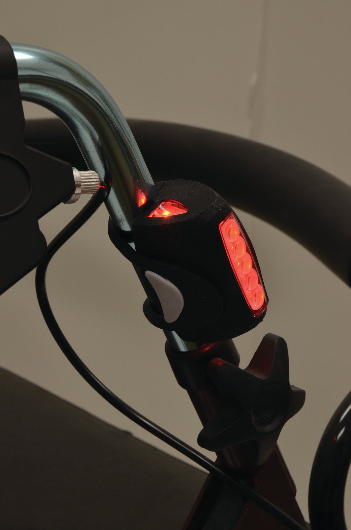 LED light on a handle of a rollator lit up in red