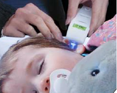 Toddler having Ear Temperature taken