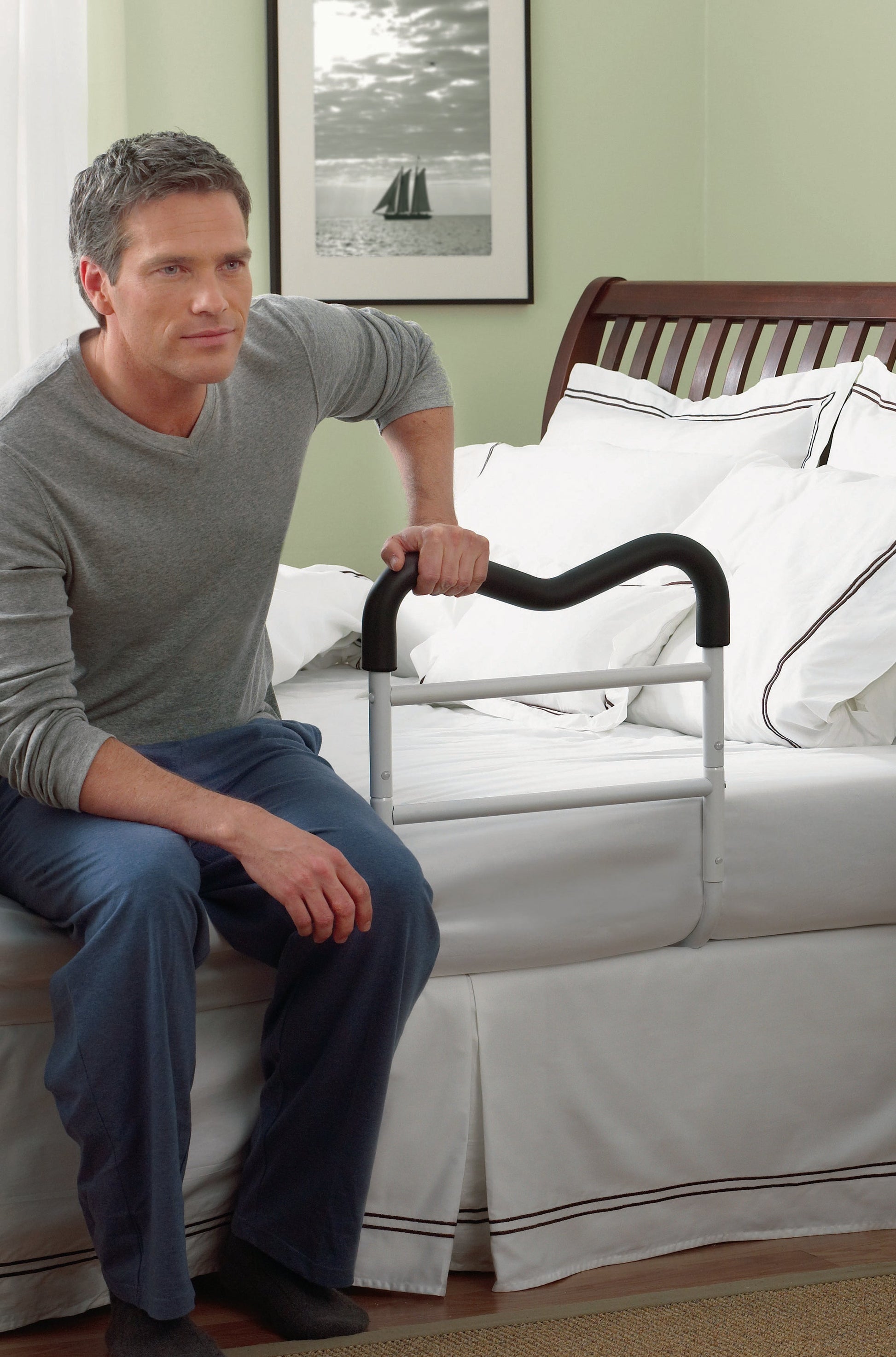 Man using and Adjustable Bed Rail