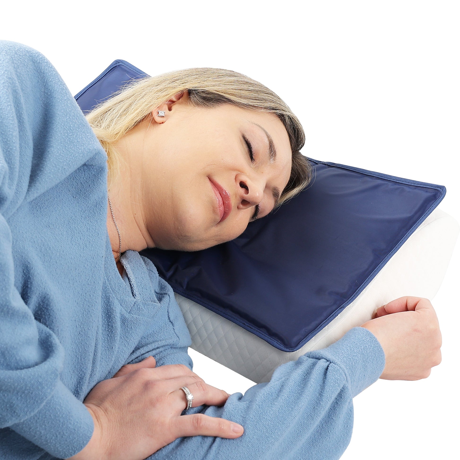 person sleeping on a cooling pad on top of a pillow